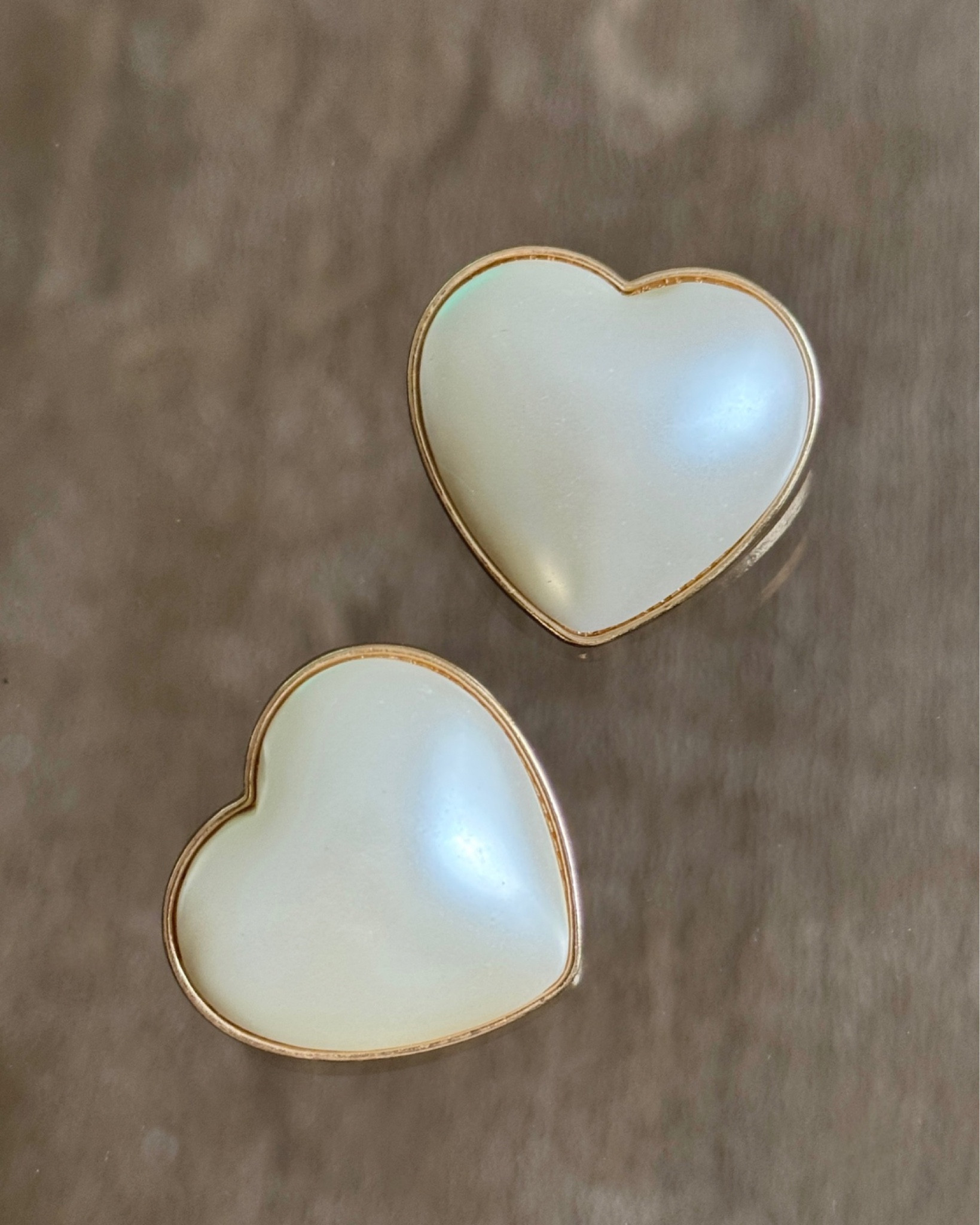These big heart shaped pearl earrings - wearing them on repeat. The perfect fun, classy and chic statement earrings to any outfit this season🤍✨ Such a find! 

#LTKStyleTip #LTKFindsUnder50 #LTKParties