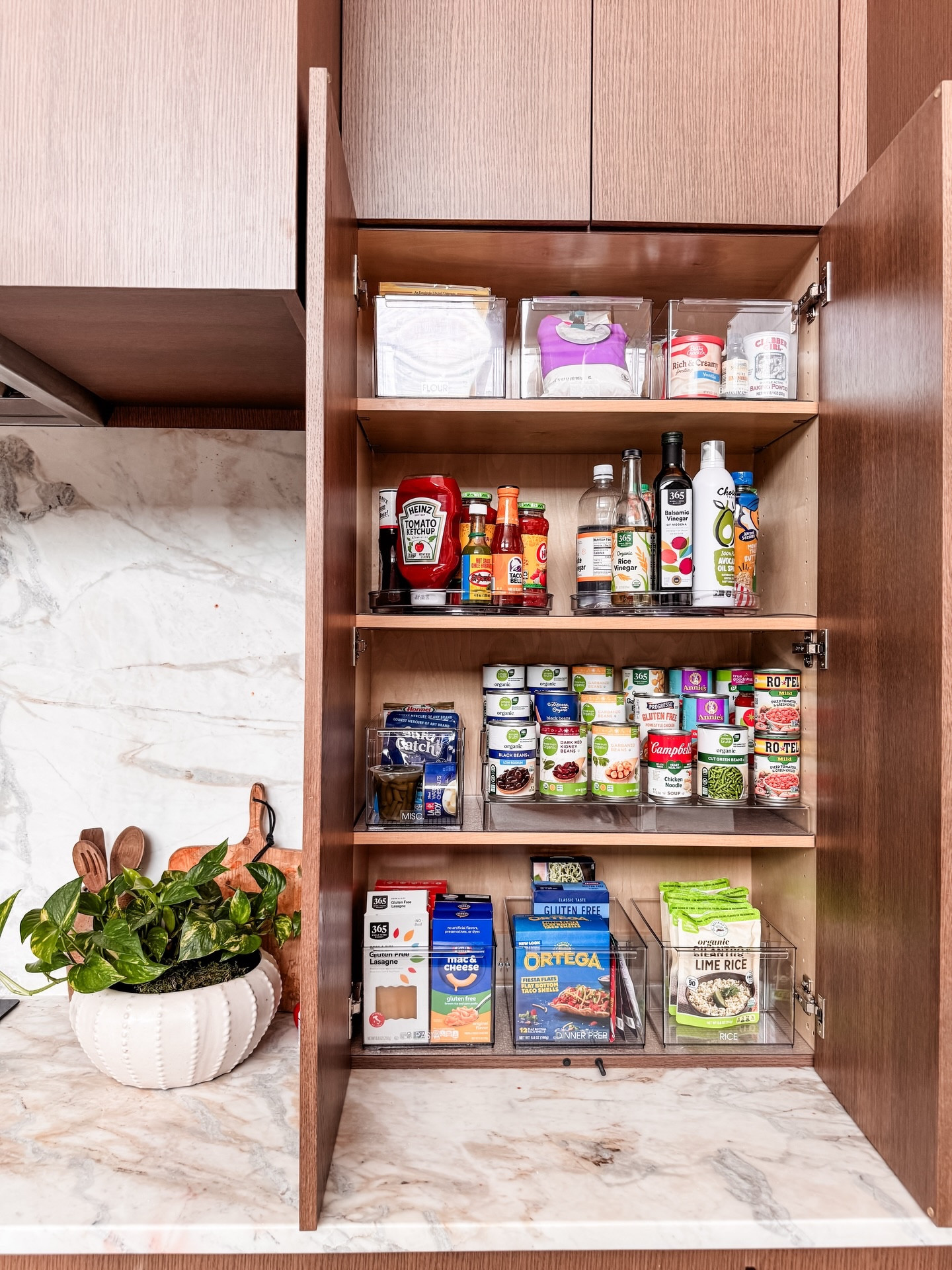 Picture perfect. But also manageable systems that meet you where you’re at. We promise it’s possible.

Our custom liners now carefully line each and every cabinet and drawer, ensuring cabinetry is protected for good. We implemented systems to lessen food waste (meal prep items go in the kitchen, while snacks take over the pantry) and lots of items were rehomed within the kitchen based on use.

Our #1 goal when organizing a space is to create a CUSTOM system that works for the entire family.