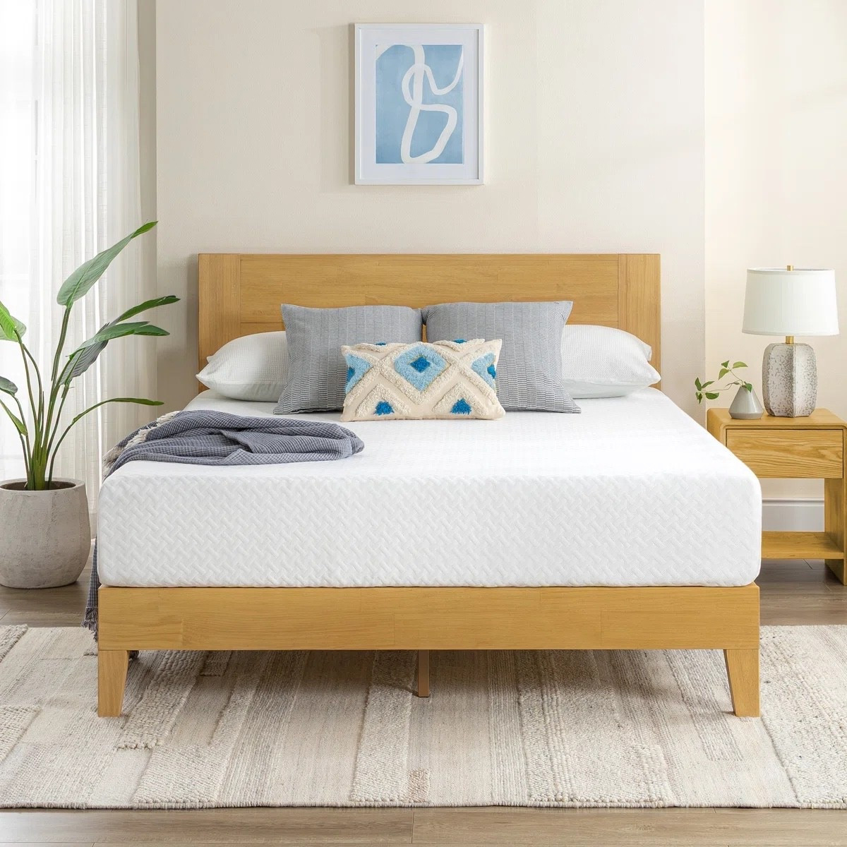 If you’re looking for a cooling mattress upgrade, this 10 inch medium cooling gel memory foam mattress from Wayfair Sleep is such a solid find. It has that contouring memory foam feel with a breathable, cooling design that’s perfect for hot sleepers. Styled here with a natural wood bed frame, neutral bedding, textured rug, and modern nightstand for a calm, minimalist bedroom look.