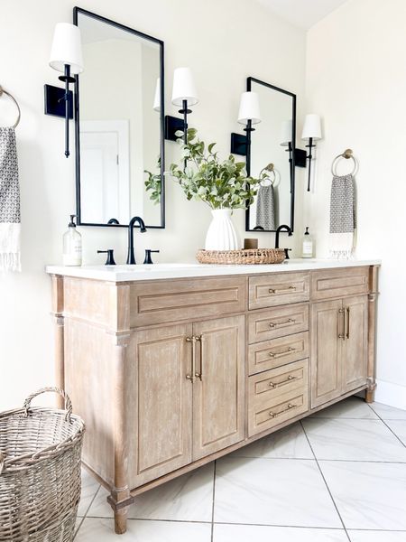 Bathroom Inspo - bathroom vanity back in stock! We did remove the gray marble top and replaced with white quartz top. 

Bathroom, bathroom cabinet, bathroom vanity, bathroom faucet, wall mirror, wall sconce, shaded sconce, bathroom lighting, hand towel, Turkish towel, vase, bathroom decor, home decor, round tray, faux greenery, champagne bronze hardware, amazon home, Amazon finds 

#LTKSaleAlert #LTKFindsUnder100 #LTKHome