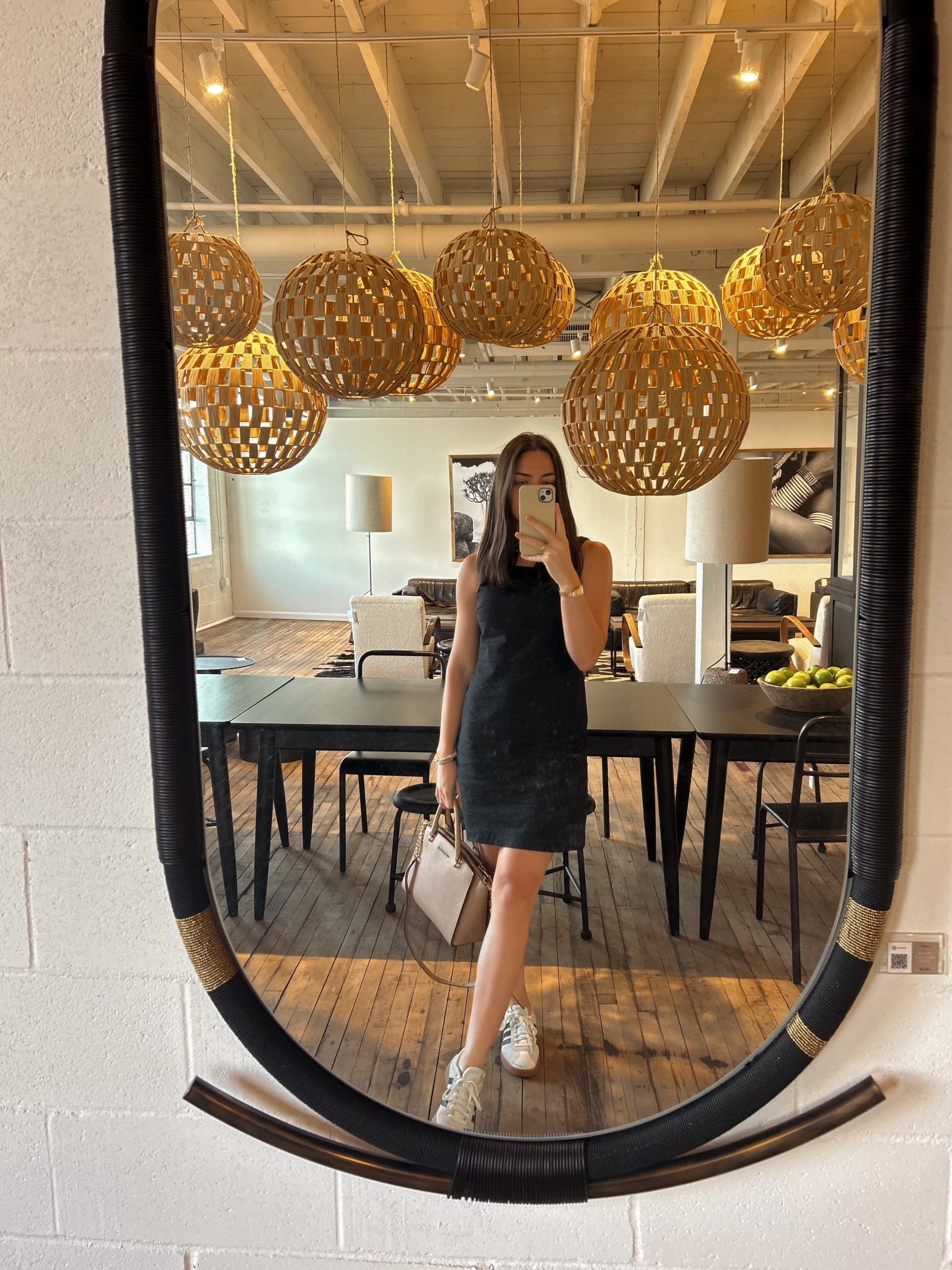 Blending fashion with interiors at High Point Market 🤎🖤 This little black dress + sneakers combo was perfect for a day of design inspo, showroom strolls, and statement lighting moments. 