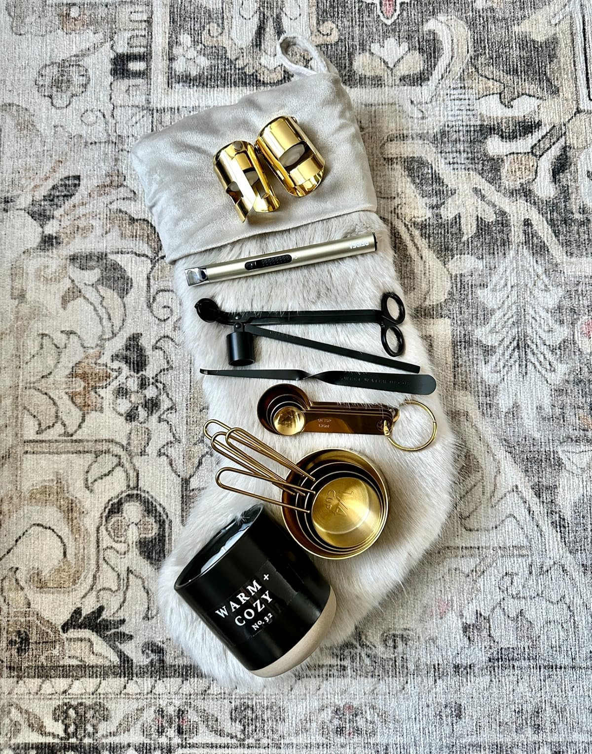 stocking stuffer gift ideas, fur stocking, gold champagne stoppers, cozy candle, candle accessories, electronic lighter, gold measuring cups, Ruggable rug, gifts for her, hostess gifts | Amazon (US)