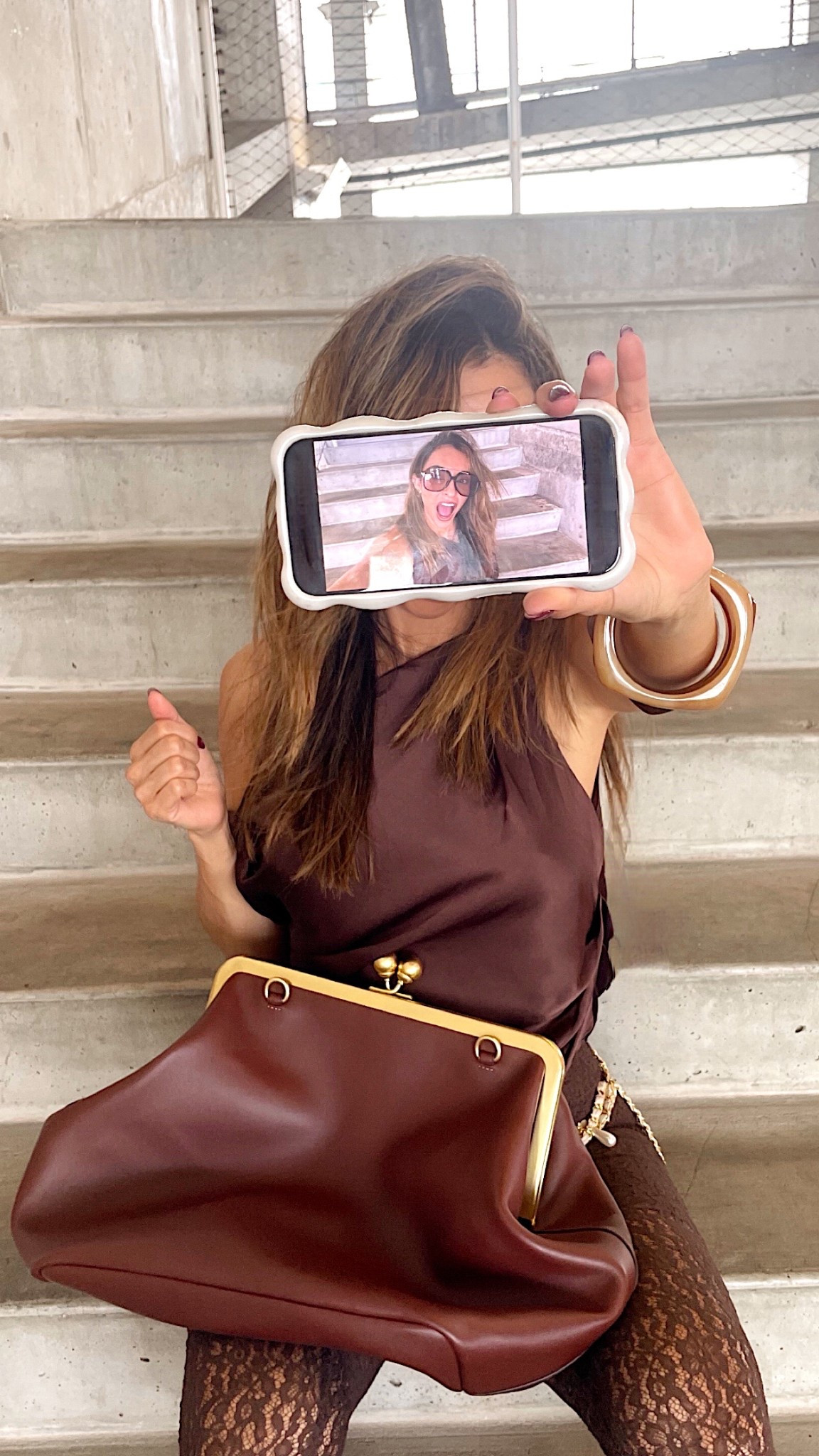 Monochrome chic in rich brown ✨ Styled with a silk halter, lace tights, oversized kiss-lock bag, and bold resin bangles. Effortless statement textures, all in one tonal look. 

#LTKU #LTKSeasonal #LTKStyleTip