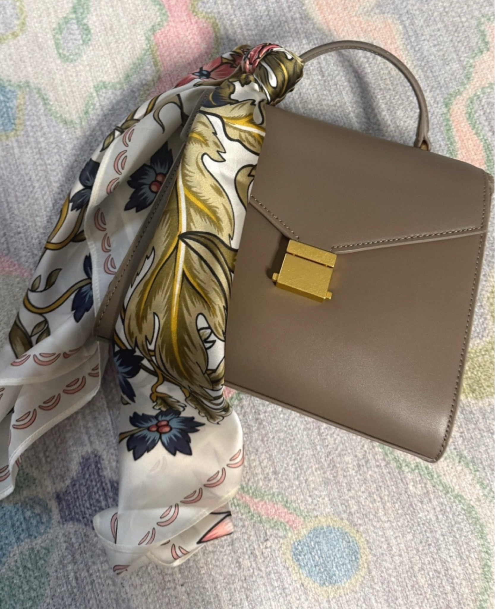 Love this bag- such a good hand bag and holds so much stuff! Made from Italian leather, and I tied this scarf around it to add some color. 

#LTKValentine #LTKmomlife #LTKgrwm