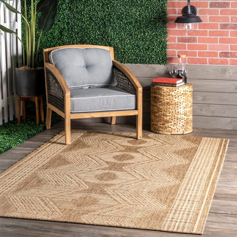This tribal indoor/outdoor area rug from Wayfair is such a versatile staple for both your living room and patio. The neutral tan geometric pattern pairs beautifully with a wood accent chair, woven side table, and cozy cushions, making it perfect for layering into any space. ✨ Durable and stylish, it’s ideal for high-traffic areas indoors or outdoor setups.

#LTKSaleAlert #LTKHome