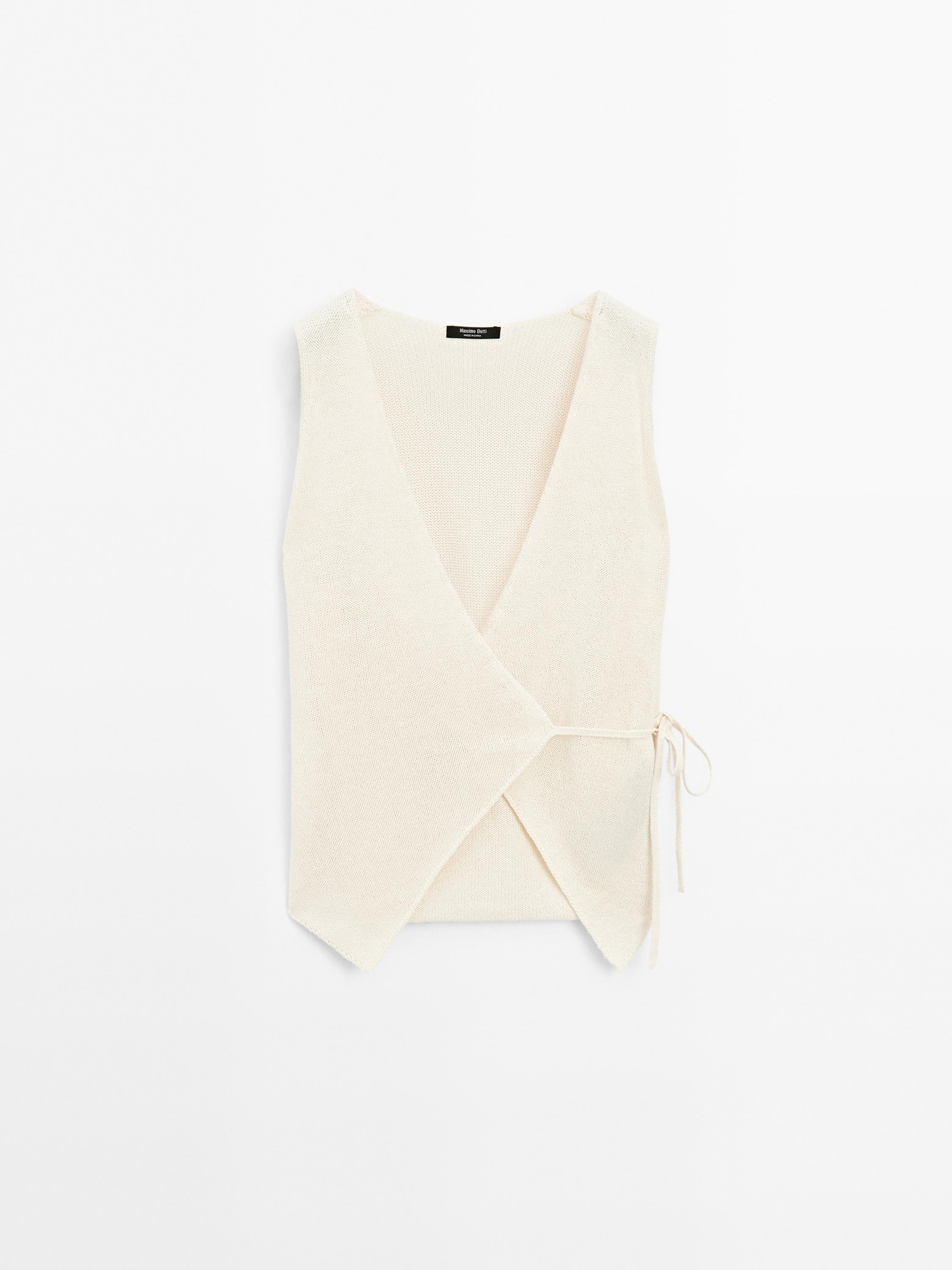 Knit vest made of a cotton blend. V-neck . Sleeveless. Drawstring fastening. Made in mouliné yar... | Massimo Dutti US