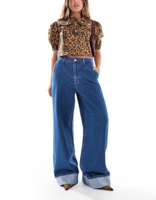 ASOS DESIGN high rise wide leg jean with turn up in mid blue | ASOS (Global)