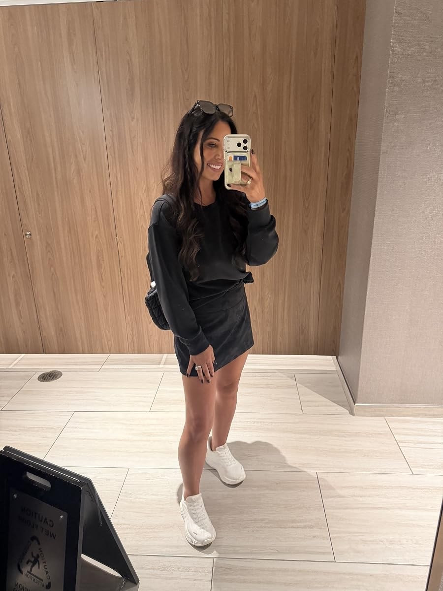 The cutest all-black travel outfit! This matching sweatshirt and skirt set looks so good paired with white sneakers for a sporty finish.
#TravelOutfit #MatchingSet #AllBlackOutfit #SportyChic #LTKTravel