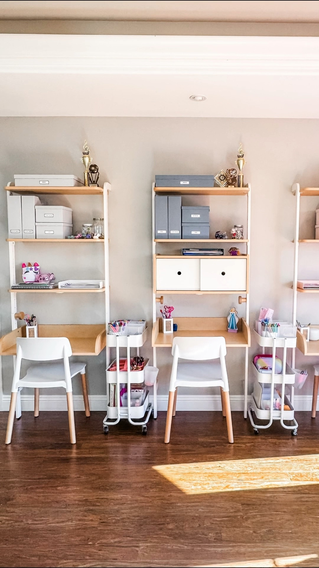 To transform and organize these desks that belong to three little girls, I removed a shelf from two of the desks and better space planned the remaining shelves to accommodate storage solutions. The rolling caddies were organized to contain all of the art + craft supplies. And we used simple storage boxes giving each girl their own color to conceal items that Mom did not want lingering on the shelves. We love the way this turned out! ￼

#LTKmomlife #LTKHome #LTKKids