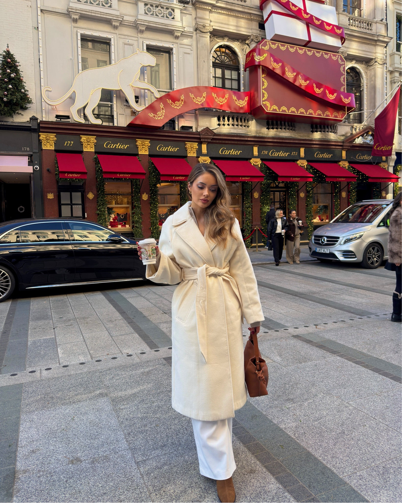 Molly Mae photobombing wasn’t on my bingo card ✨ bag is tagged on my Instagram @ zaraannec 

The cosiest winter look! 

#longcoat #longwhitecoat #hm #mango #whitetailoredtrousers #whitecoat #formalcoat #beltedcoat #womenscoat 

#LTKworkwear #LTKwinter #LTKfestive