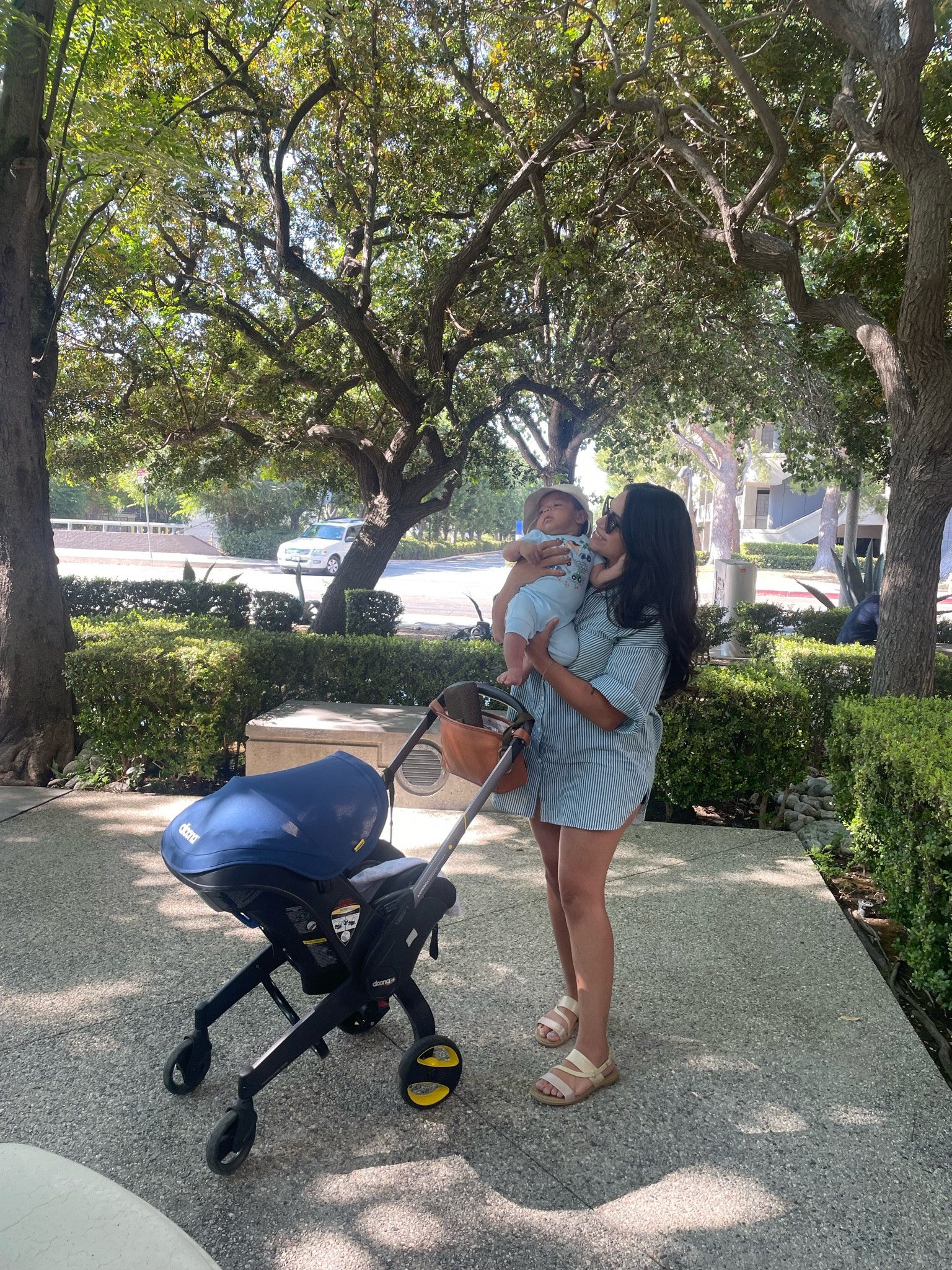 Our everyday morning stroll! I love this bucket hat for Benji and the Doona stroller is an absolute must, dress from Cider!

#LTKBaby #LTKFamily #LTKSeasonal