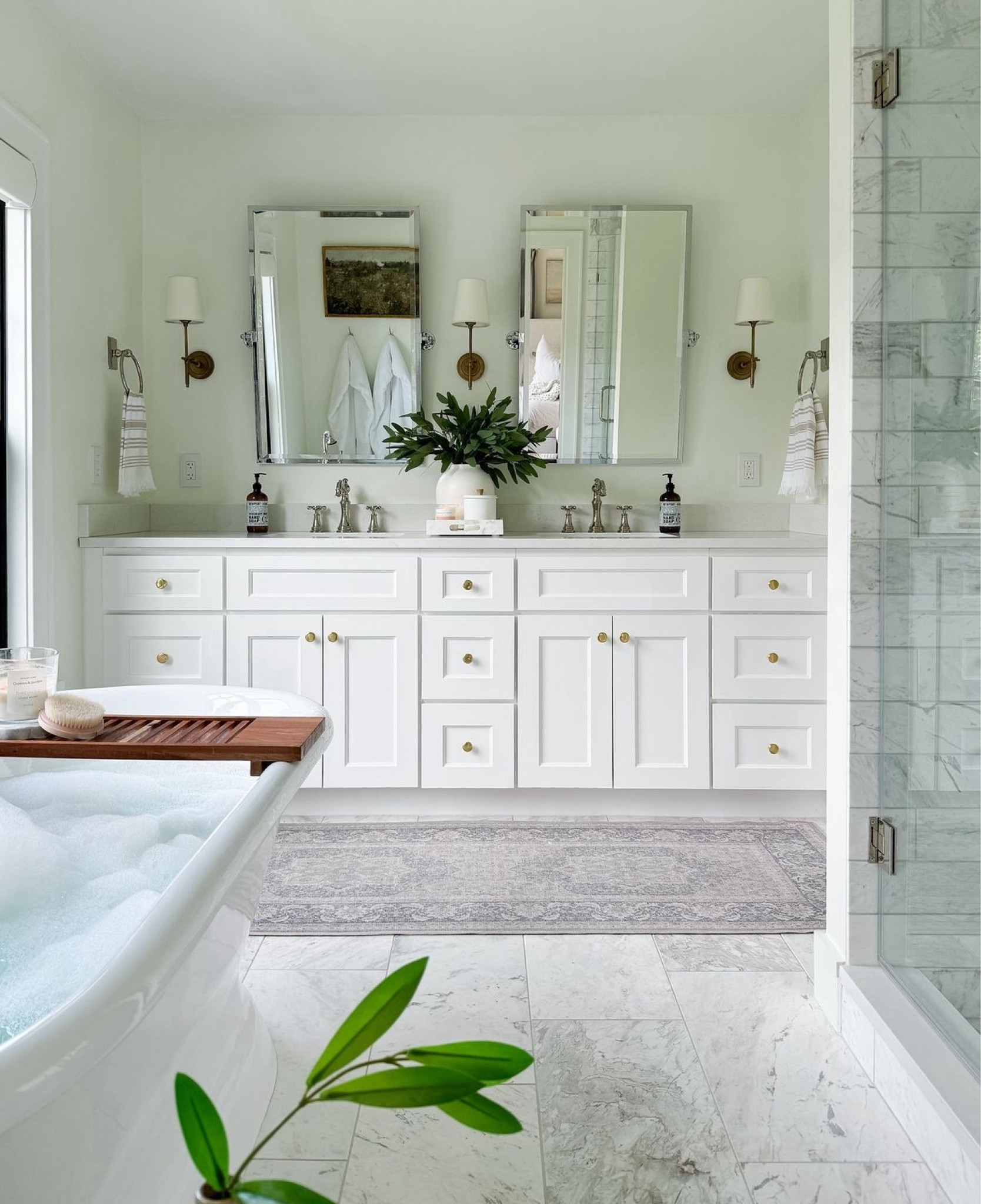 Shop my classic white bathroom design. I love the classic marble mixed with the soaking tub and mixed metal mirror and plumbing finishes. My bathroom runner is washable and perfect in the kitchen too.

#LTKHome #LTKStyleTip #LTKSaleAlert