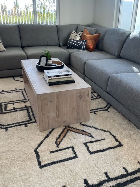 Client’s living room with the Gather Sectional in gray from Crate & Barrel. 

Coffee table is the Folsom from Pottery Barn. 👍🏻

#ltkhome #sectional #coffeetable #livingroom #arearug #familyroom