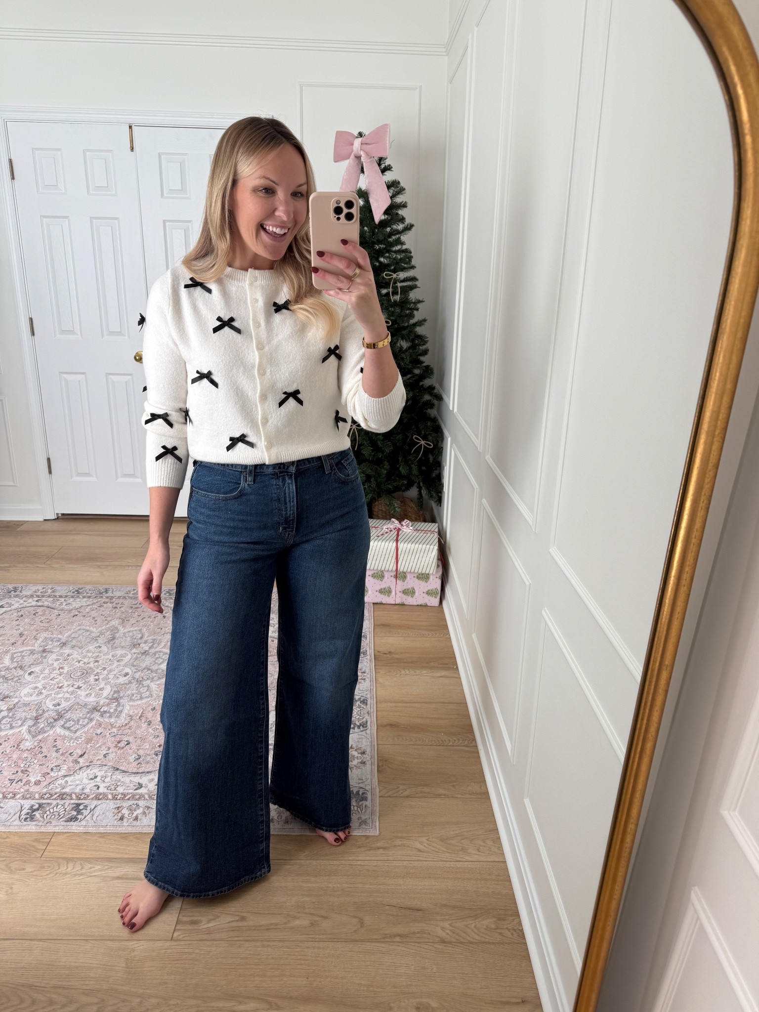 Bow sweater and wide leg jeans - casual winter outfit - holiday outfit 

#LTKHoliday #LTKMidsize #LTKSeasonal