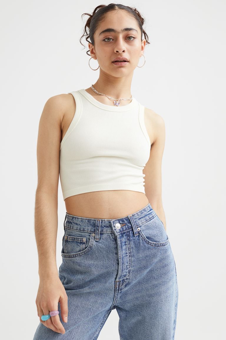 Short, fitted tank top in ribbed jersey. Narrow cut at top with a round neckline. | H&M (US + CA)