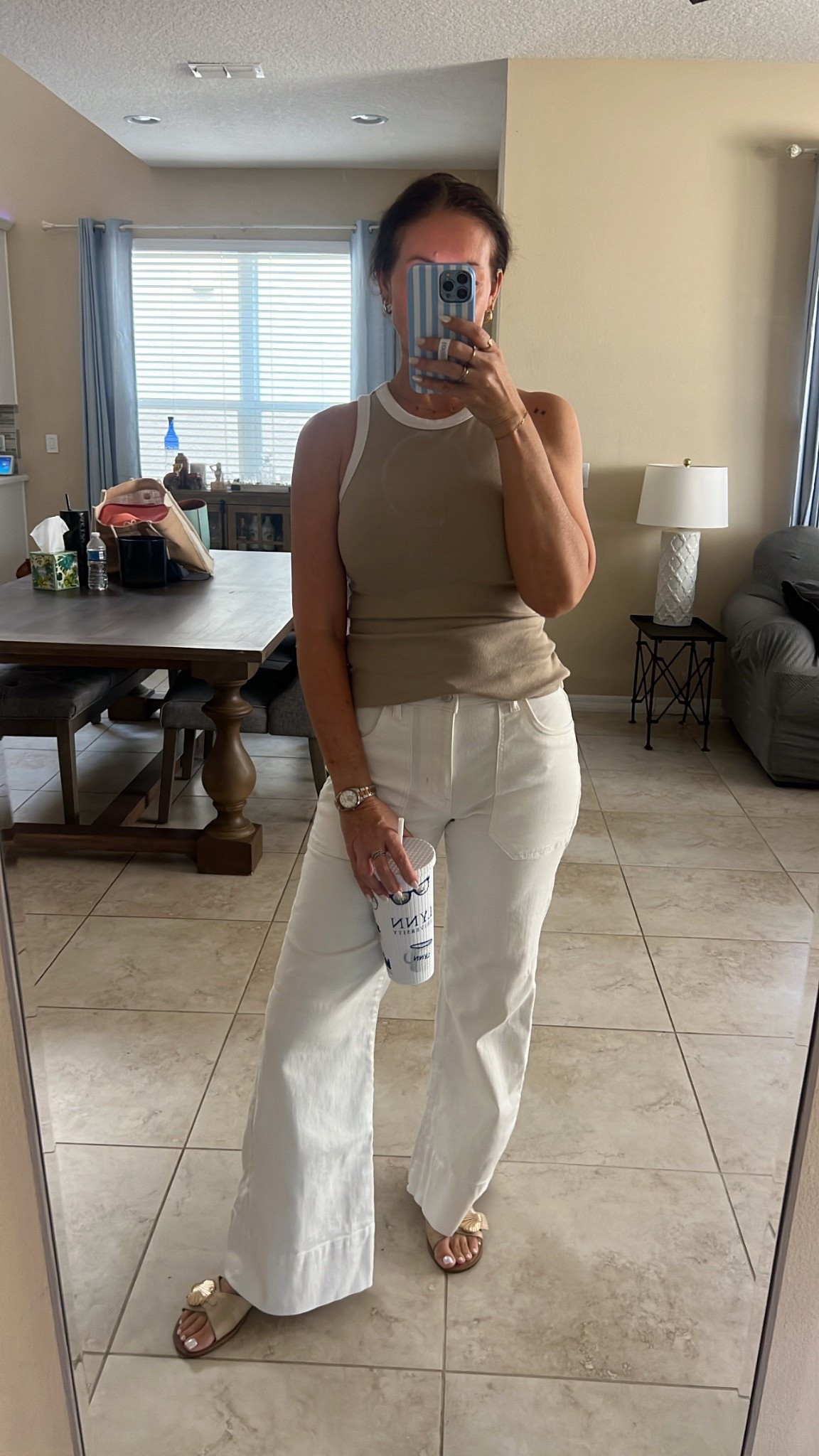 White flare jeans, high neck tank with piping

#LTKootd #LTKMothersDay #LTKmomlife