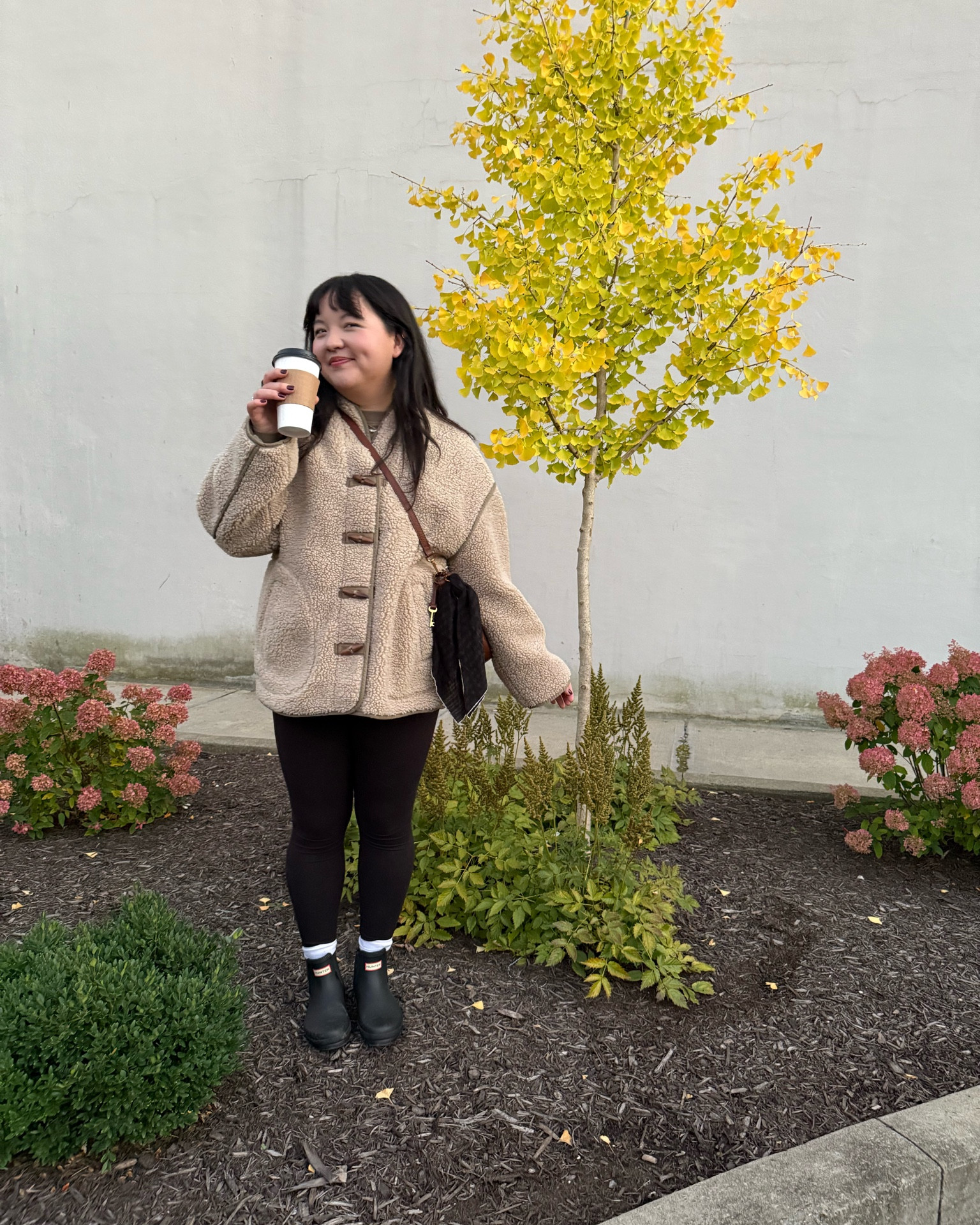 You can find me with and oversized jacket and beverage in hand 99% of the time