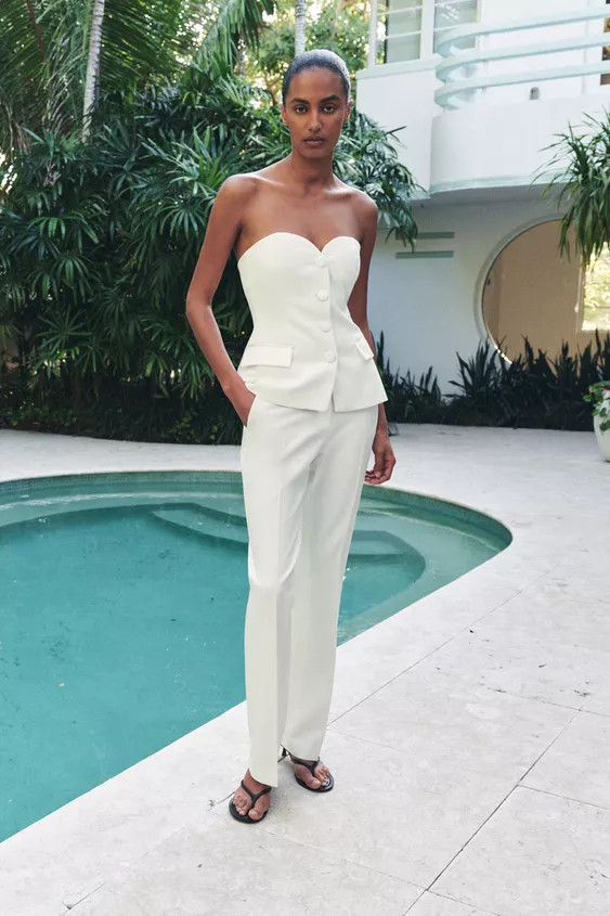 Sweetheart neckline top with off-the-shoulder design. Front placket detail with tonal satin fabri... | Zara US