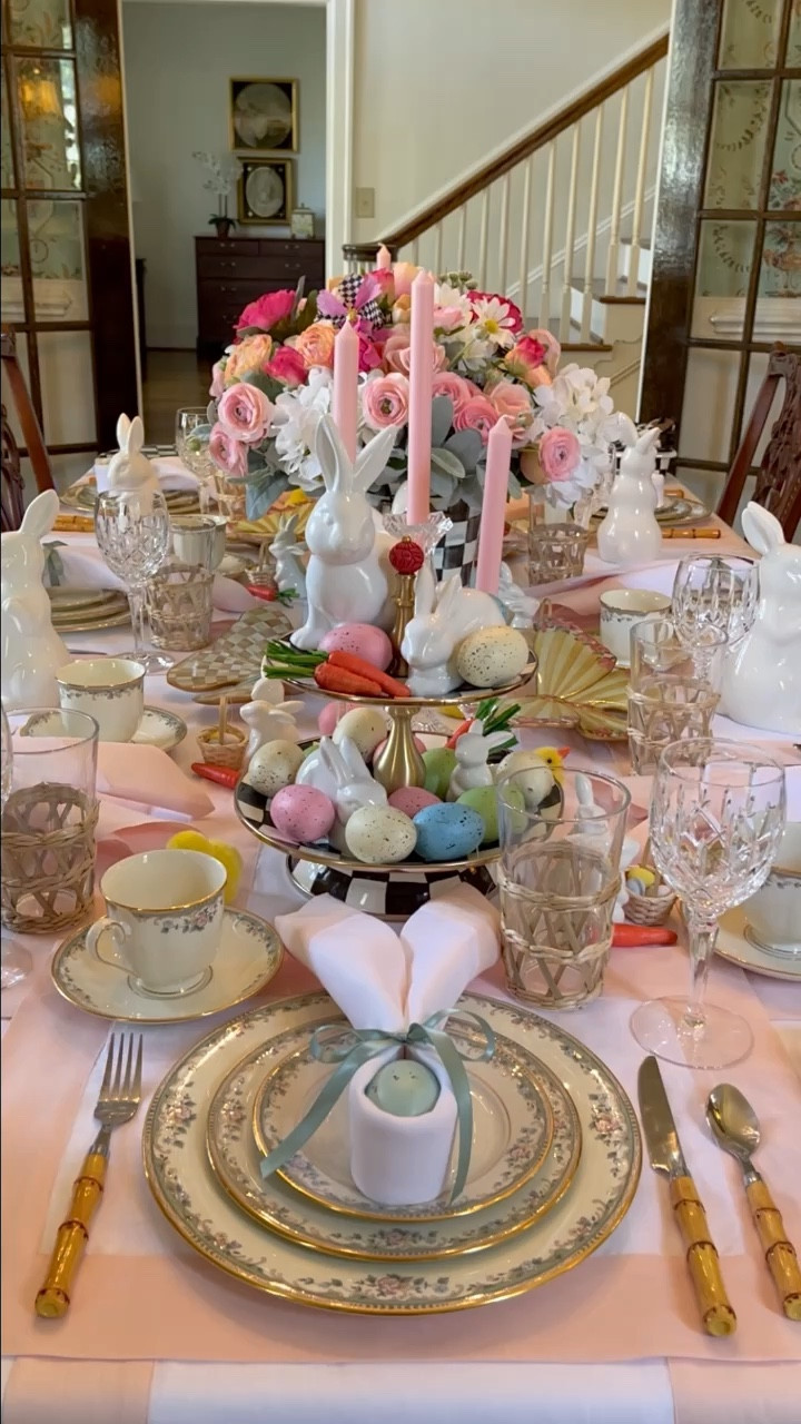 Strolling down memory lane, I stumbled upon a treasure trove of Spring tables from last year that somehow never made their grand debut on my feed. 🌸🐰 It's funny how the years add wisdom but seem to take away a bit of our memory, isn't it?🤦🏼‍♀️ But hey, every cloud has a silver lining, and mine is brimming with unshared tables just waiting to bloom this Spring!🌷🐰 Today, I'm giving you a closer look at the whimsical table that caught your eye last week, showing how to make the bunny ear napkin fold. I've heard whispers that my tables might be too adorned, leaving little room for the feast itself. To that, I say: my creations are less about practicality and more about sparking joy and inspiration. 🎨🍽️ Like an artist lost in the flow of their brushstrokes, I let my imagination lead the way when setting these tables. They can be as simple or as lavishly detailed as the moment calls for - there are no rules in the art of tablescaping! And if you're worried about space for your delicious dishes, remember, buffet-style serving is a fabulous solution. My aim is to inspire and ignite creativity in your own home styling adventures. So here's to creating tablescapes that speak volumes and turn meals into memorable gatherings! What do you think about this table? Is it one that you might try to recreate?🏁🐇🥕🌷
.
.
.
#eastercenterpiece #southernladymag #entertainandcelebrate #dressingthetable #thecollectedlook #southernhomemagazine #myupcountrystyle #preppygrandhome #traditionalinterior #springtable #mycollectedhome #victoriamag #springtablescape #styleonmytable #diningroominspiration #settingthetable #diningroomdetails #springcenterpiece #tablescapestyle #collectabeautifullife #postitandsmile #dressyourtable #classicdecor #eastertable #centerpieceideas #placesettingideas #thenewsouthern #easterinspiration #placesetting #traditionalhomemag

#LTKparties #LTKhome #LTKSeasonal