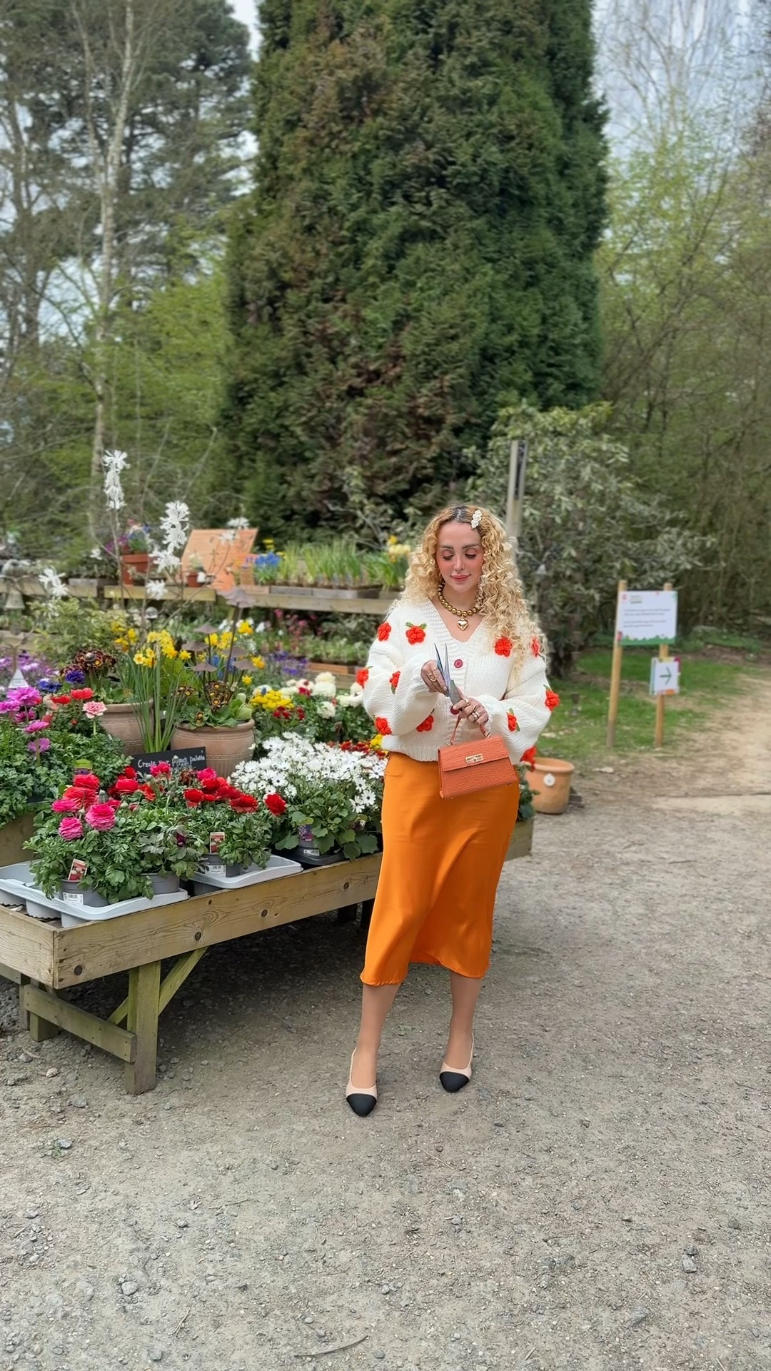 Spring orange outfit inspo 🧡🍑🍊 Chunky cardigan with orange flowers and orange satin skirt 

#LTKspring #LTKuk #LTKAprilSpotlight