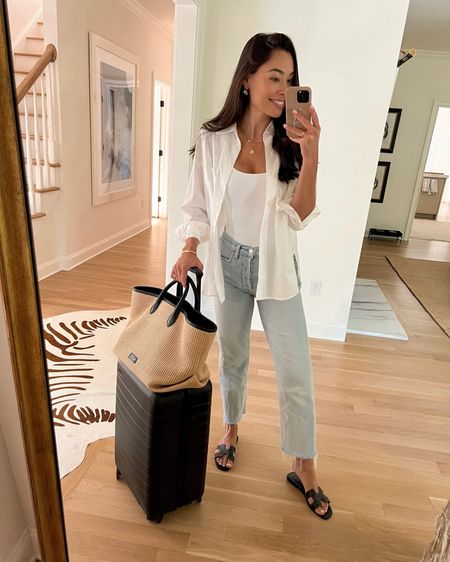 Kat Jamieson wears her favorite denim jeans, white button down, bodysuit and Khaite tote with an Away suitcase to travel. Travel style, relaxed fit. 

#LTKtravel #LTKSeasonal