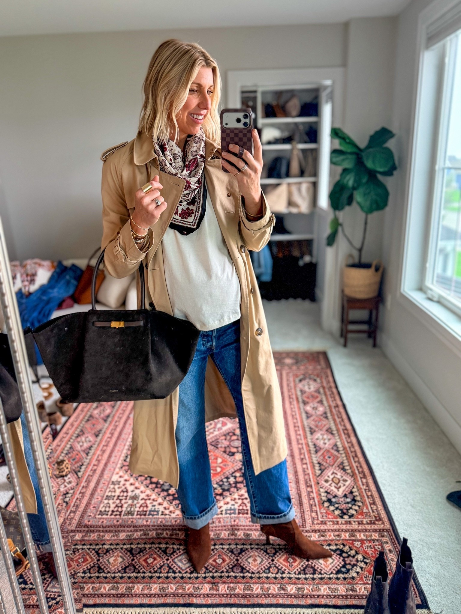 Looking elevated in a basic tee + straight leg jeans is easy when you have the right layers + intentional accessories. A trench coat, weather proof (but chic) boots, a fun scarf + handbag you love and can wear with everything. 

This trench has been my go-to for the past 2 seasons, it fits true to size. I’m 5’10” westing a medium

#LTKootd #LTKOver40 #LTKSeasonal