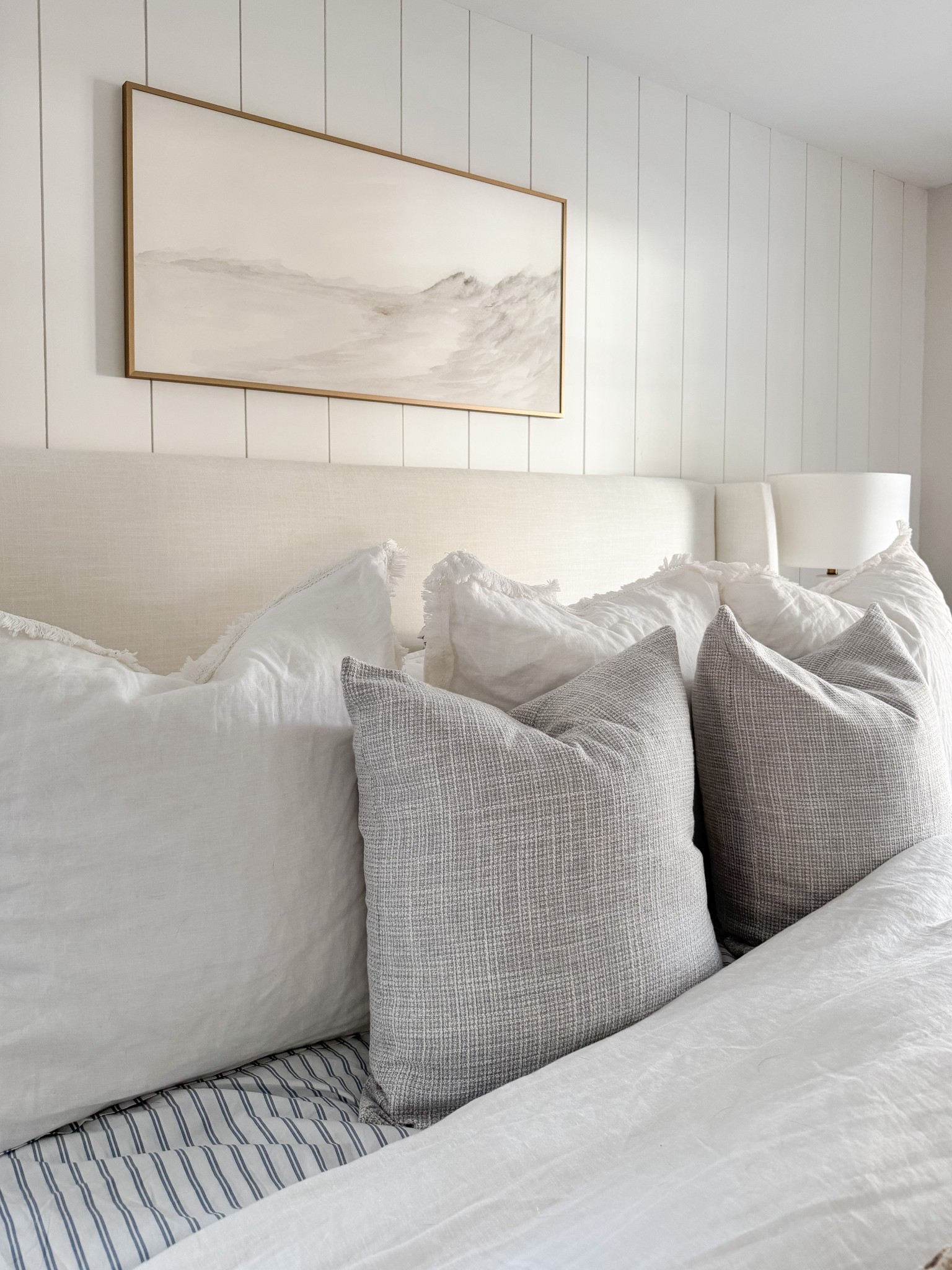 Layered bedding, warm wood tones, and soft textures make this coastal bedroom feel calm and complete. coastal bedroom decor, neutral bedroom, upholstered bed, woven bench, coastal home style, serene bedroom, timeless interiors, bedroom inspiration, sherricalnanhome

#LTKHome