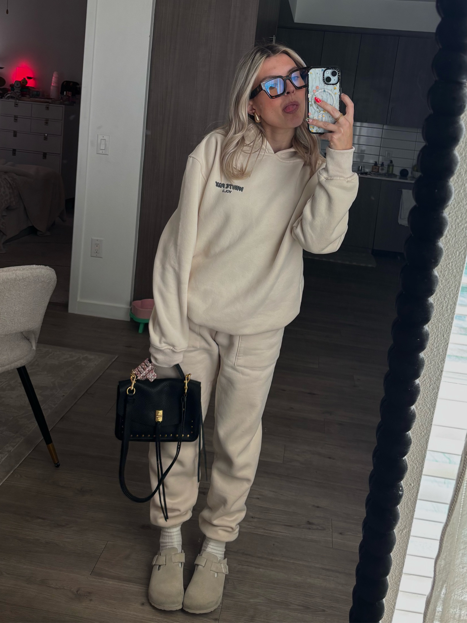 White fox sweatsuit, Amazon glasses, Birkenstocks, and a black leather bag

#LTKActive #LTKPetite #LTKTravel