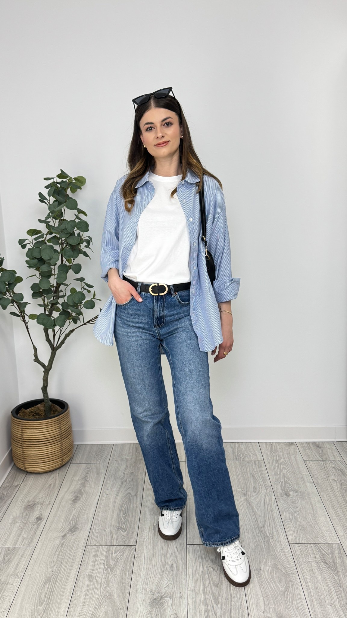 White t-shirt, blue wide-leg jeans, blue striped shirt, white sneakers, black purse, black belt, sunglasses. A clean and relaxed outfit with timeless layering and sporty energy 🦋 #IlaStylesDiary 

#LTKspring #LTKeurope #LTKworkwear