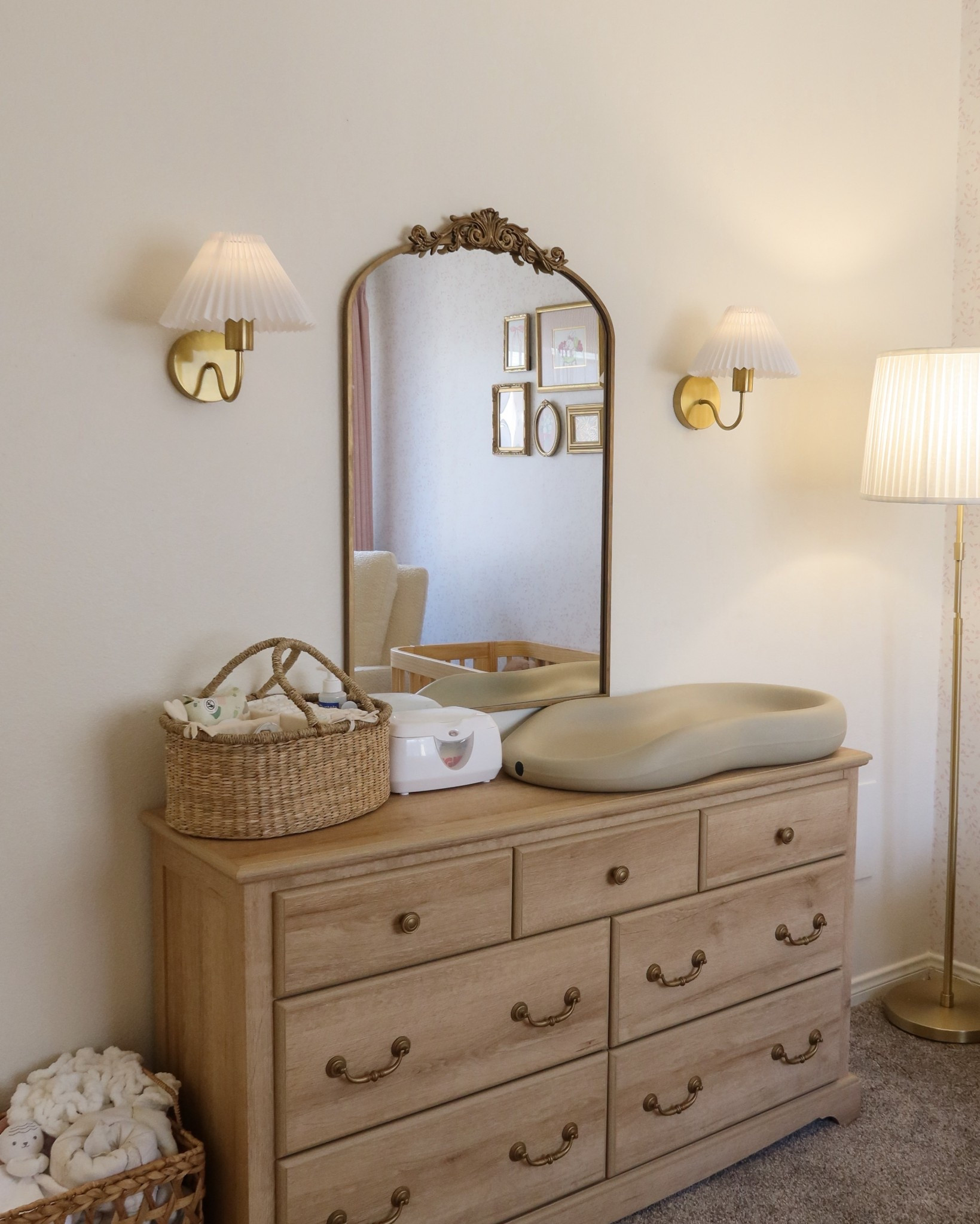 Baby Nursery | diaper changing table, wooden dresser, diaper caddy, vintage mirror, wall sconcess

#LTKHome #LTKBaby