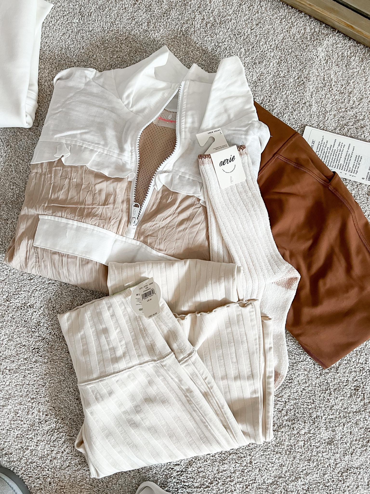 This pullover (small) has a pretty ruffle detail and perfect to layer over the top of an athleisure look. Paired it with cream yoga pants (medium). 

#LTKstyletip #LTKtravel