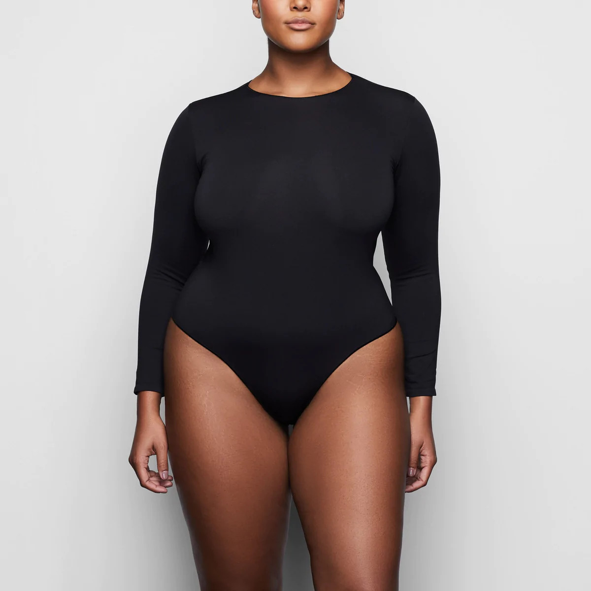 ESSENTIAL CREW NECK LONG SLEEVE BODYSUIT | SKIMS (US)