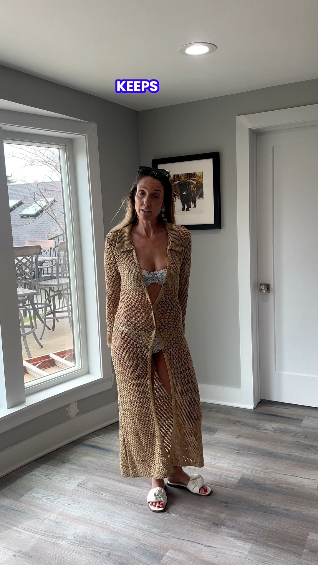 A floor-length crochet cardigan is the ultimate way to elevate your favorite swimwear for a poolside lunch. 🥂✨ This tan open-knit layer adds just enough texture and coverage while keeping the look light and breezy. Tap the link in my bio to shop this exact cover-up and my go-to white slide sandals! #CrochetStyle #ResortWear #SwimCoverUp #ShopTheLook @VICI 

My Golden Hour Crochet Style Breakdown
• The Layer: I’m wearing a floor-length, open-knit crochet cardigan in a warm tan or sand-colored shade, featuring a button-down front and long sleeves.
• The Swimwear: Underneath, I’ve layered the cardigan over a white and blue printed bikini for a classic coastal contrast.
• The Footwear: I finished the look with a pair of white flat slide sandals featuring a knotted strap detail.
• The Accessories: To keep the focus on the knit texture, I’ve opted for simple statement earrings and kept my hair down with sunglasses perched on top.
• The Vibe: This ensemble is the definition of "luxury resort"—it’s a curated, textured look that feels expensive yet relaxed, perfect for a tropical destination.

tan crochet cardigan, longline knit cover up, open knit maxi duster, printed bikini, white slide sandals, knotted flat sandals, resort wear outfit, beach vacation style, boho summer layer, coastal aesthetic, LTKstyle

#LTKSwim #LTKTravel #LTKFestival