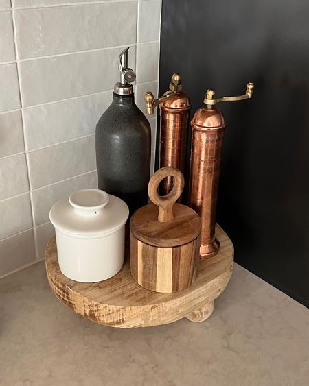 Wood riser, salt and pepper grinder, etsy oil carafe, salt and butter jars