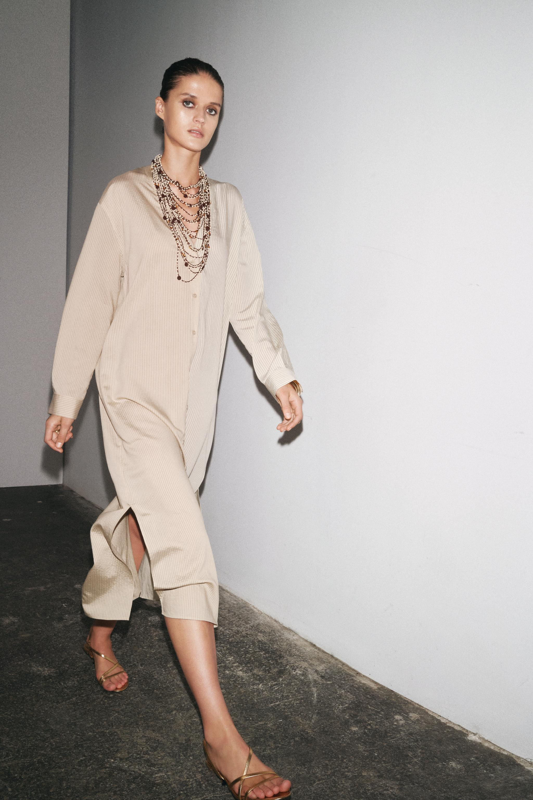 ZARA WOMAN COLLECTIONMidi dress made of a viscose blend knit. V-neck and long sleeves with cuffs.... | Zara US