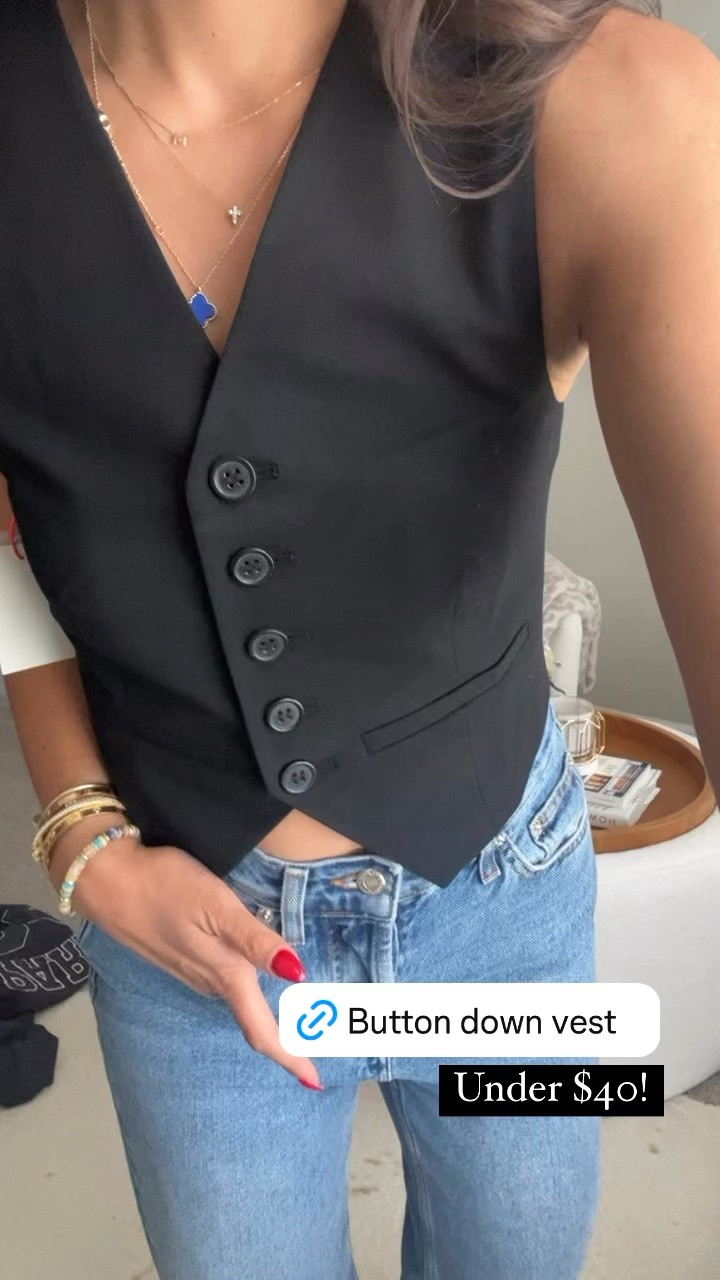Black button down vest in the NSALE. Wearing xs