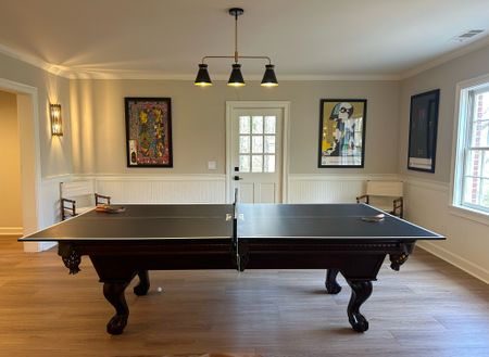 Game Room updates. 
Ping pong conversion topper for the pool table | mid century style linear light fixture in black and gold. 

#LTKSpringSale #LTKsalealert #LTKhome