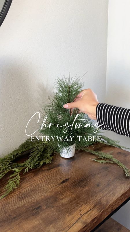 Christmas entryway table decor with a table top tree, ceramic houses, greenery, and reindeer!

#LTKVideo #LTKhome #LTKHoliday