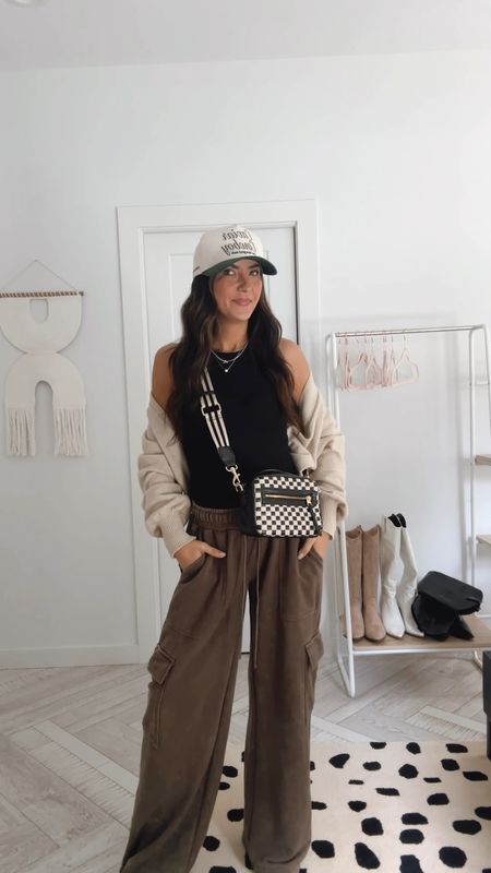 Weekend wear the perfect casual cozy outfit! These wide leg cargo pants are everything. Styled with checkered crossbody bag and favorite cowboy baseball hat. Summer outfit. Travel outfit  

#LTKStyleTip #LTKTravel