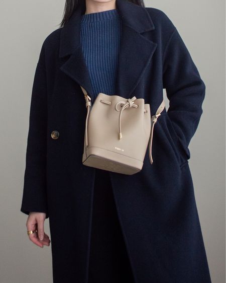 This neutral-toned bucket bag is the perfect size to house all my necessities and I just love the structure of it! Linking the cardigan (size XS) as well which I’m wearing backwards so it looks just like a crewneck sweater 💙

#LTKstyletip #LTKSeasonal #LTKitbag