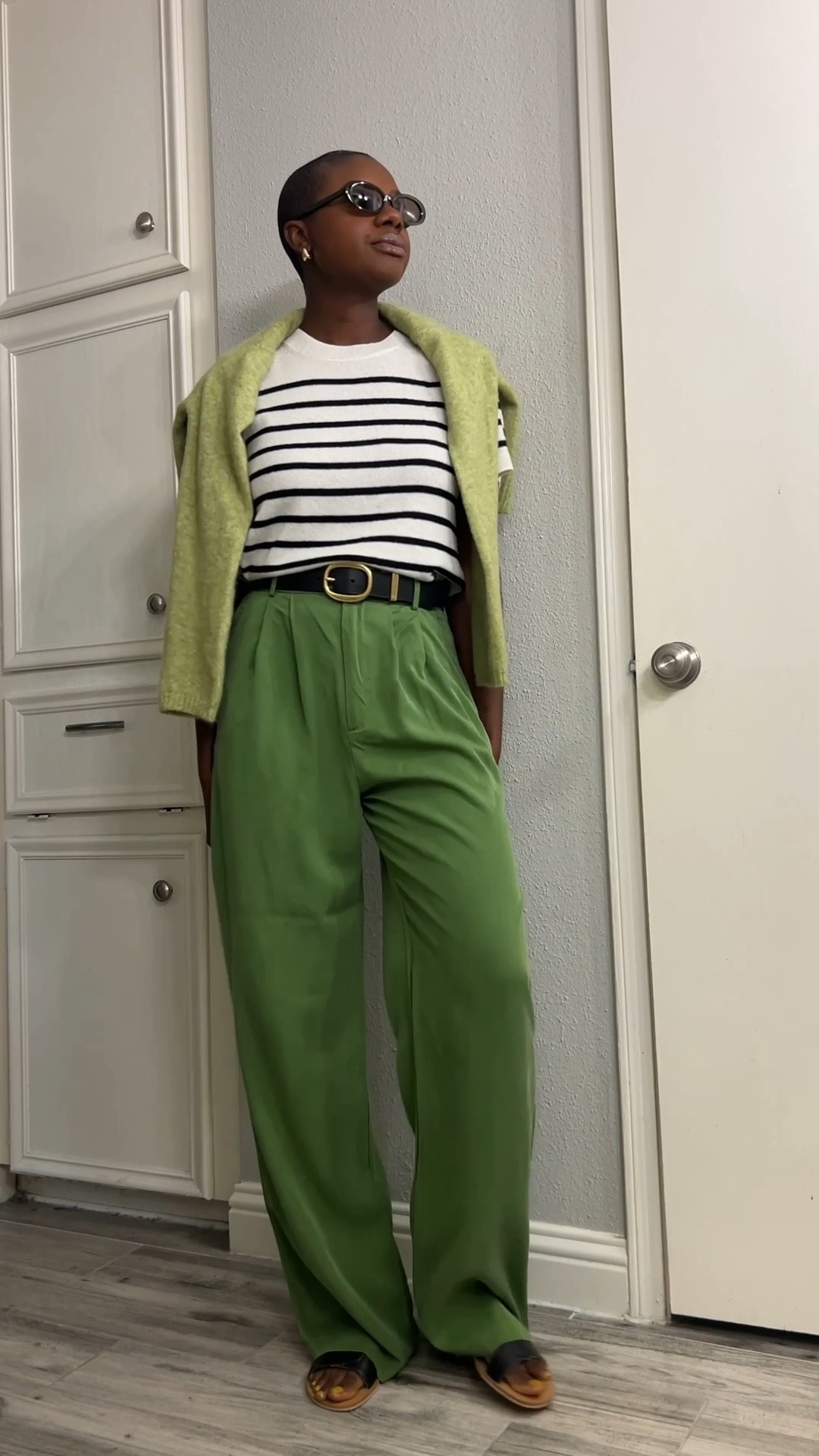 Teacher outfit! White cashmere sweater with stripes, green wide leg pants, light green cardigan, black leather slide sandals and black belt with gold hardware  

#LTKFindsUnder100 #LTKWorkwear