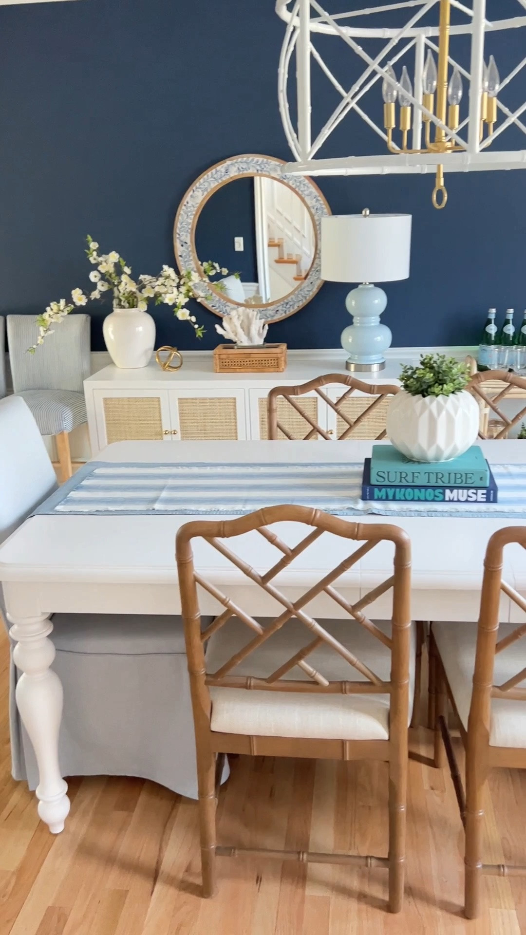 My coastal dining room features a white dining table, blue dining chairs, and blue and white accent pieces for a classic modern coastal look. I love how the crisp white furniture paired with layered blue and white decor makes this space feel bright, airy, and designer-inspired.

#LTKHome #LTKSaleAlert