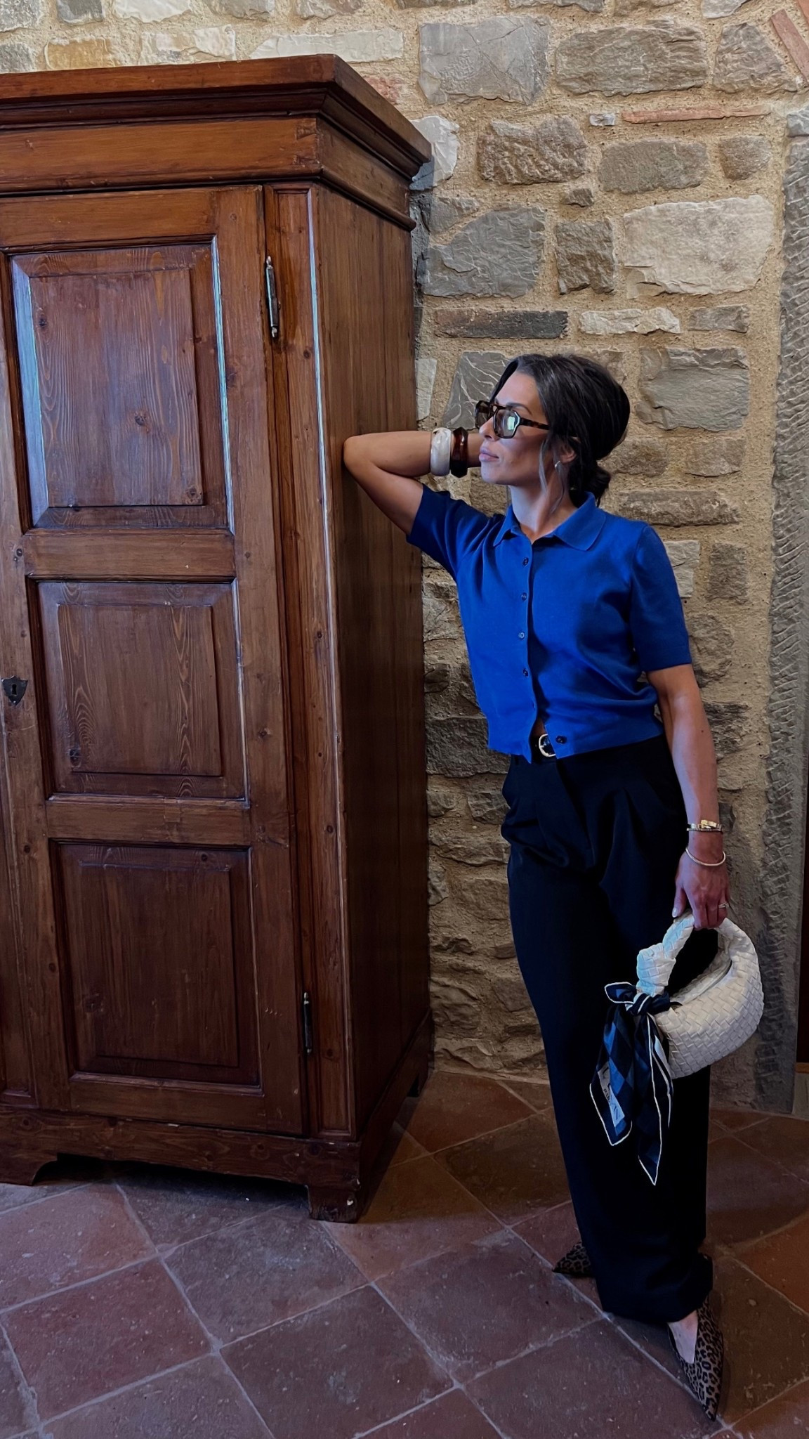 Cobalt blue short sleeve polo button up. Black trousers. Leopard slingback flats. Acrylic bangles. Autumn style. Fall style. Autumn outfit. Fall outfit. What I wore in Tuscany. Tuscany style. European style. Outfit inspo. Style inspo. What to wear. 

#LTKFindsUnder100 #LTKTravel #LTKootd