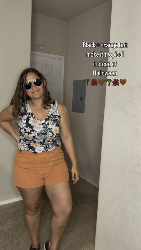 Tropical tank top with orange shorts. Super comfy and cute look for the beach and for summer!

#LTKmidsize #LTKVideo #LTKtravel