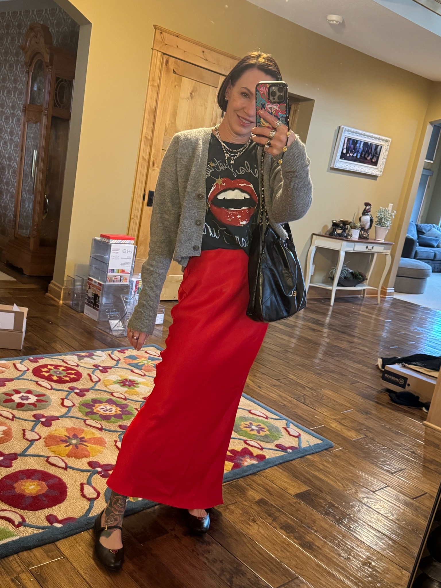 Birthday fall inspo outfit! Loving this red colored satin maxi skirt paired with a graphic t-shirt and a layered with a grey cropped cardigan and Prada ballet flats. Bag is Chanel. 

#LTKSeasonal #LTKStyleTip #LTKOver40