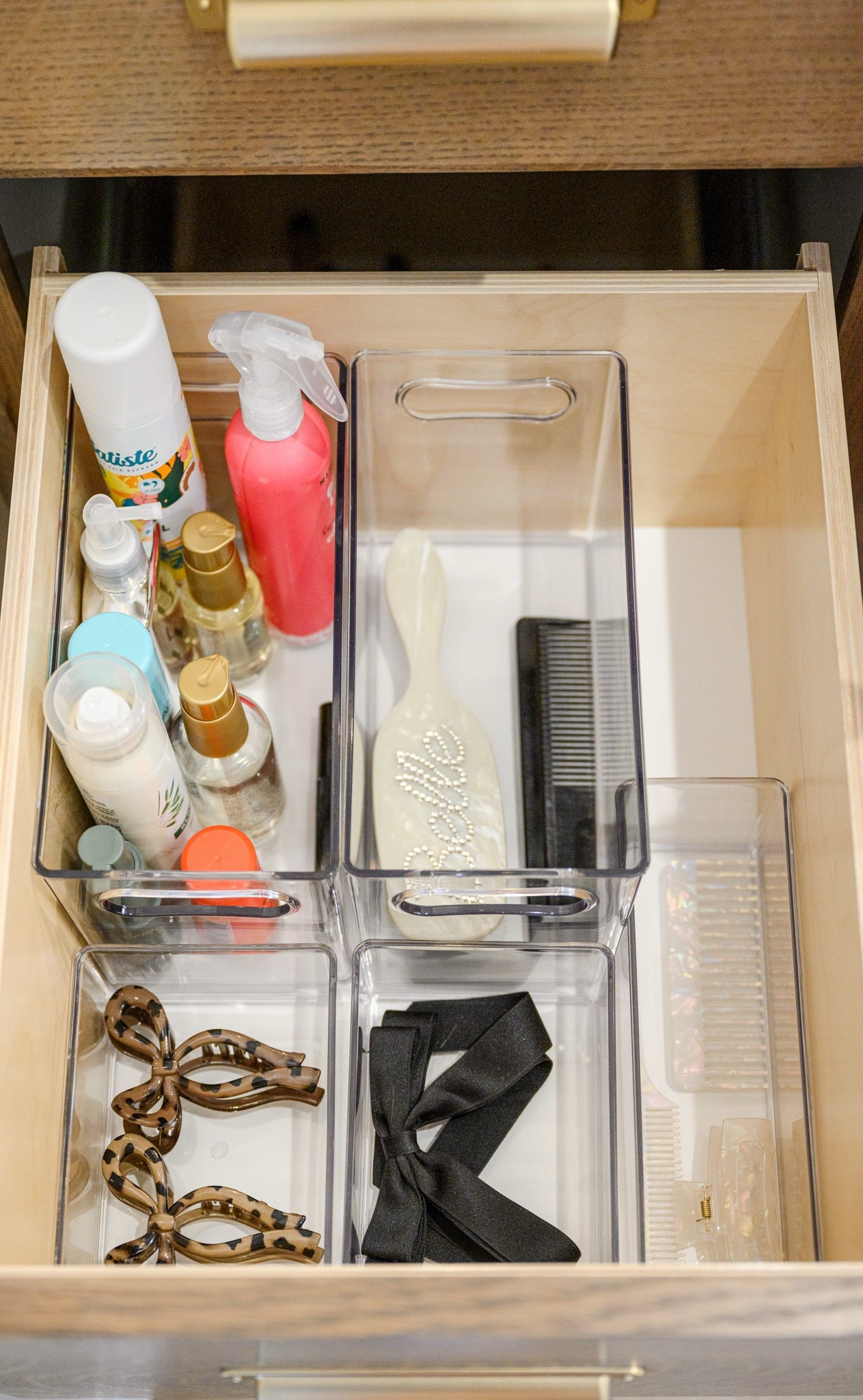 Organizing my bathroom drawers! I love these clear containers to keep things in their plahands up

#LTKHome #LTKFamily #LTKFindsUnder50