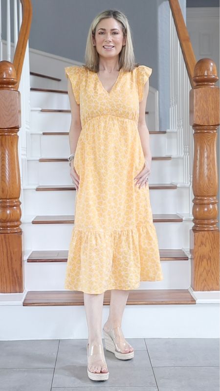 This picture doesn’t do the dress justice. The yellow is brighter and the white floral pattern is embroidered. It has pockets and also comes in the same print in navy. Runs TTS-wearing XS  