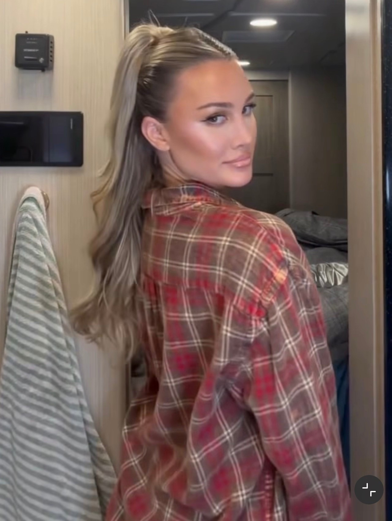 Designed to be distressed, Brittany Aldean wears an edgy top features a slouchy, button-down silhouette, paint-splattered cotton fabrication, and mismatched buttons for a crafty touch.