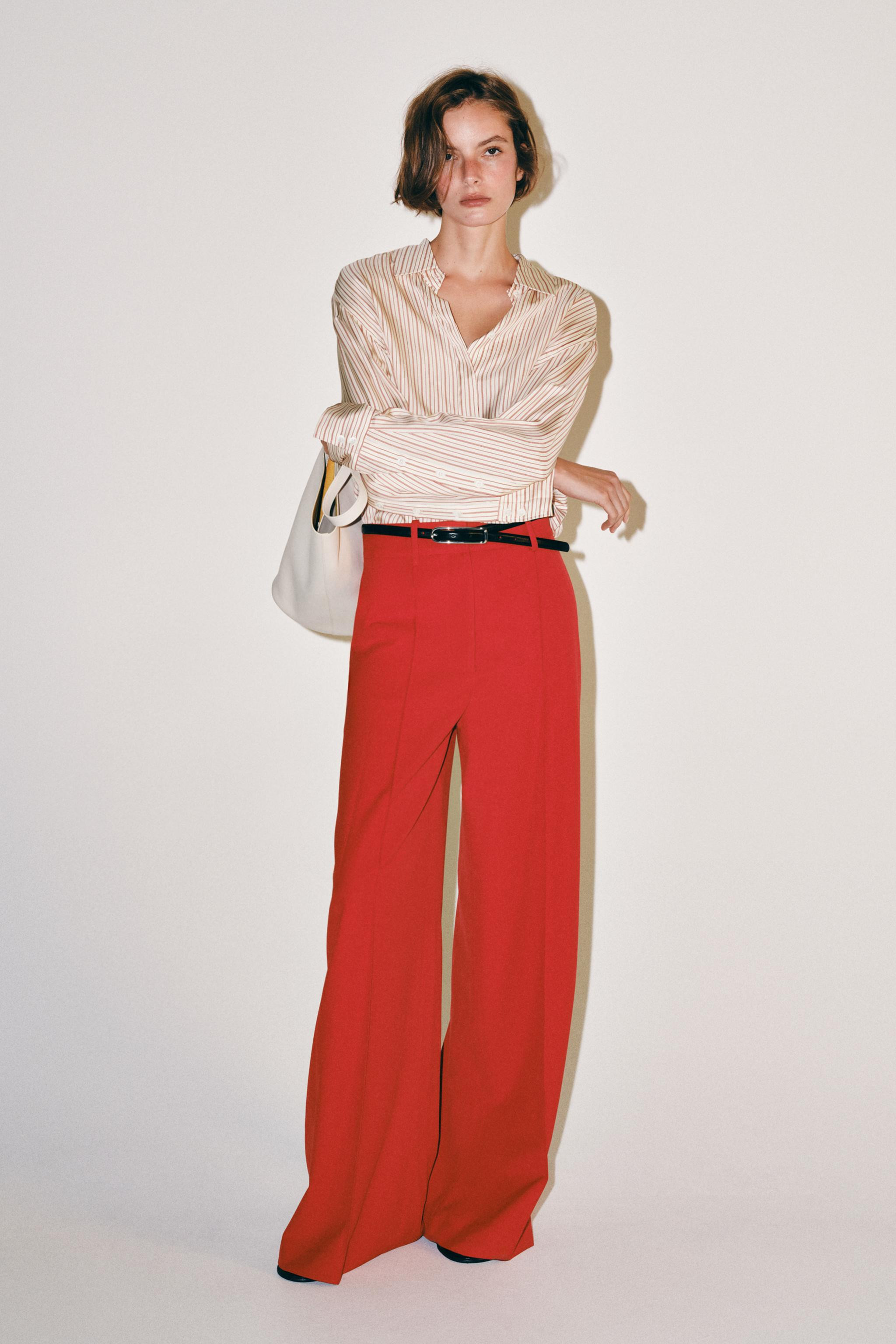 ZARA WOMAN COLLECTION. Trousers made with 24% viscose yarn. Mid-rise with belt loops. Hidden side... | Zara US