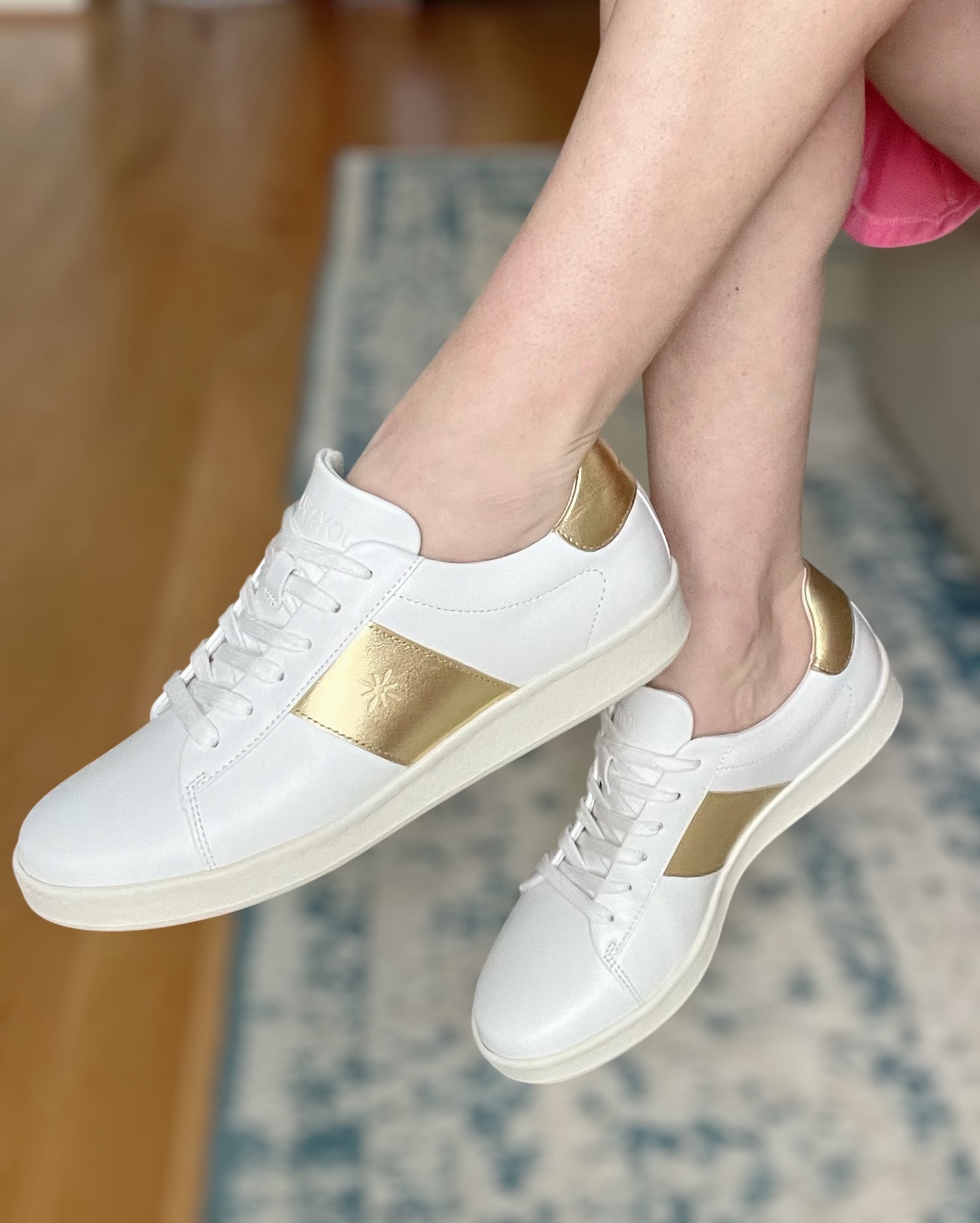 Gold & White Leather Sneakers ✨ Elevated Everyday Shoe


If you’re looking for a classic white sneaker with a little extra ✨ these are it. The gold metallic detail instantly elevates even the simplest outfit — dresses, denim, athleisure, travel days… you name it.

They’re handcrafted in Portugal with buttery soft leather, organic cotton laces, and a flexible natural rubber sole. The recycled memory foam insole makes them incredibly comfortable (no stiff break-in period 🙌🏼), and the padded heel is designed to help prevent blisters.

I love that they’re timeless and minimal but still feel special thanks to the gold accent. Such an easy way to dress up a casual look while staying comfortable all day 🤍

white leather sneakers, gold accent sneakers, elevated casual shoes, women’s leather sneakers, sustainable fashion sneakers, spring shoes, everyday white sneakers, travel shoes, classic minimalist sneaker

#LTKOver40 #LTKmomlife #LTKootd